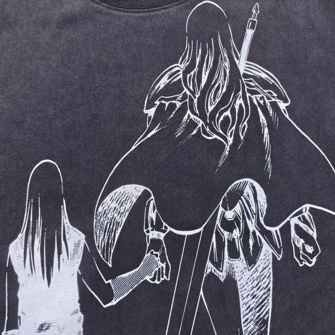 Real photo of the Legacy Passing Oversized Washed T-Shirt, print close-up