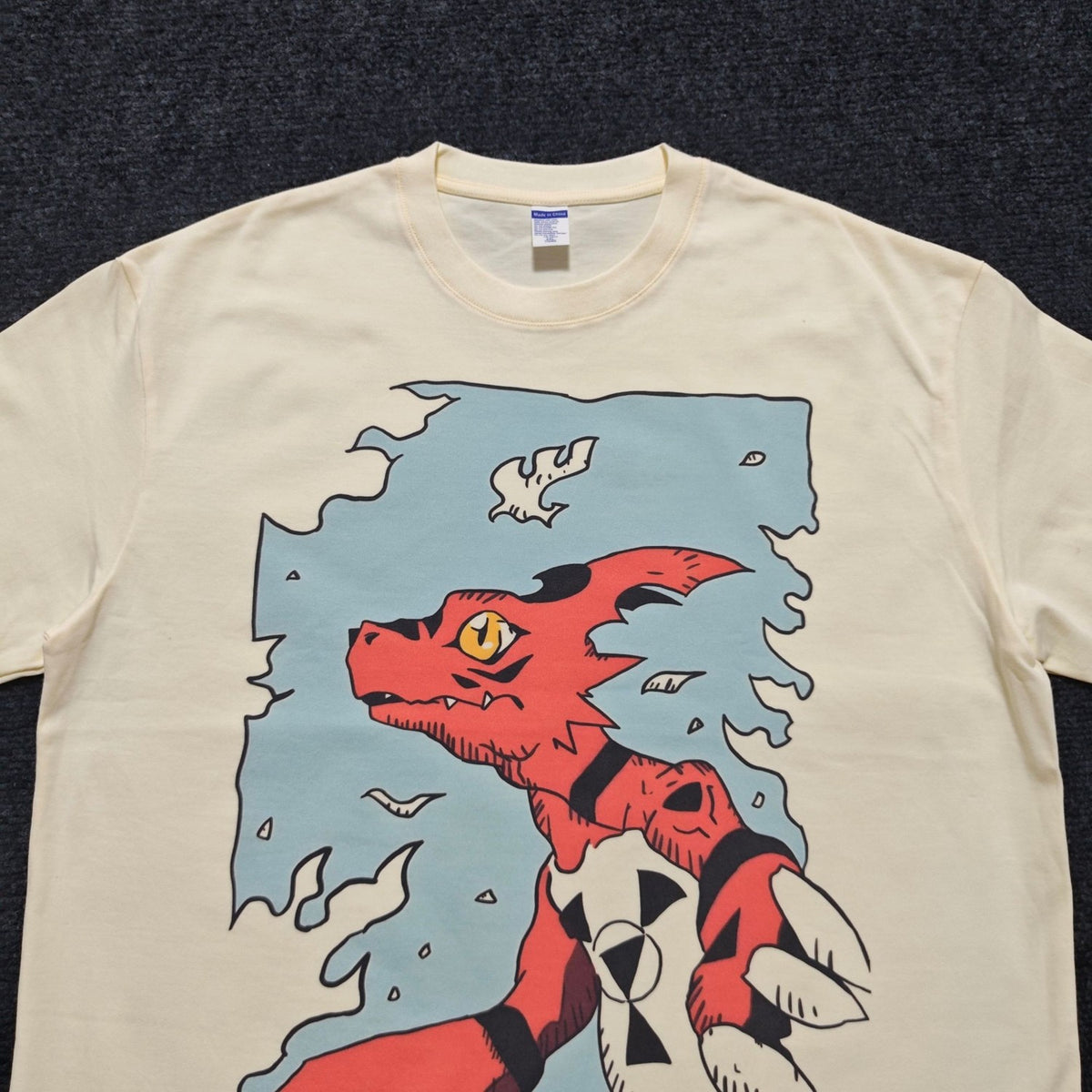 Real photo of the Guilmon Oversized T-Shirt, print close-up